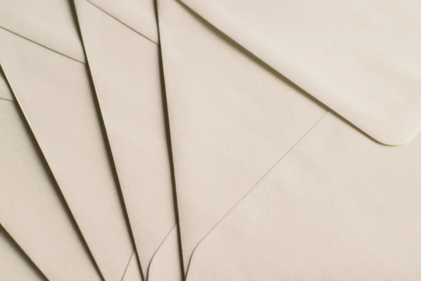 A fan of cream correspondence envelopes
