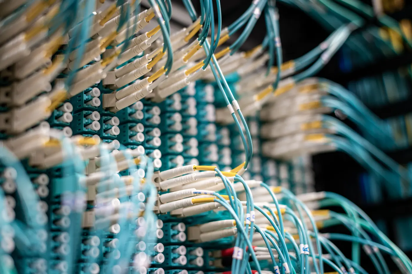 Fiber-optic patch cabling in a network cabinet